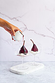 Poached Pears with spiced red wine reduction