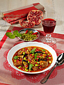 Stew with lamb, aubergines and pomegranate seeds