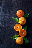 Sliced tangerines on dark backround