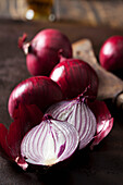 Whole and sliced red onions, close-up