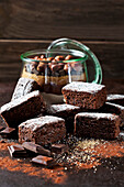 Brownies and glass of baking mix for preparing brownies