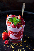 Dessert with whipped cream, strawberries and raspberries