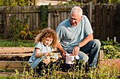 Little girl with her uncle in the garden