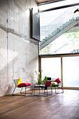 Sitting area in a loft at concrete wall