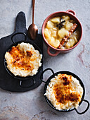 Cinnamon rice pudding brulee baked in a raclette with apple compote
