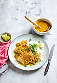 Breaded coconut cutlets with pineapple curry sauce