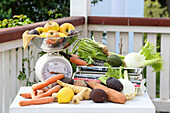 Fresh vegetables and fruit on kitchen scales