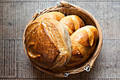 Composition of fresh bread loaves in basket