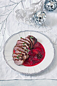 Sliced duck breast with plum sauce for Christmas