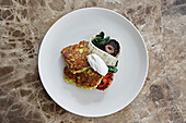 Courgette fritters with portobello mushrooms and goat curd
