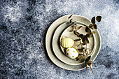 Easter minimalistic place setting with colored eggs