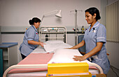 Nurses making a bed