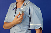 Nurse holding her fob watch