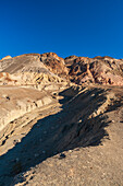 Shadows across rock formations