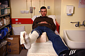Man with leg in plaster cast