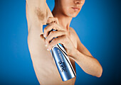 Man using deodorant