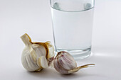 Glass of water and garlic