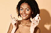 Woman moisturising skin