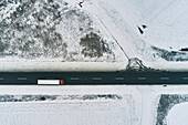 Vehicles on rural road, aerial view