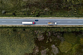 Dumper truck on rural road, aerial view