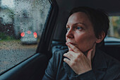 Worried businesswoman waiting in a car