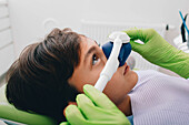 Dentist administering nitrous oxide