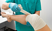 Bandaging injured knee