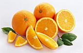Whole and sliced oranges