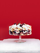 Cherry trifle against a red background