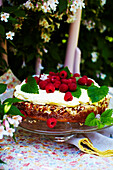 Almond cake with white chocolate mousse and raspberries