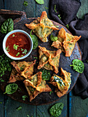Deep-fried spinach and cream cheese dumplings
