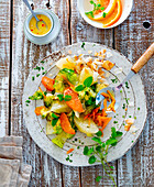 Mixed leaf salad with carrots and citrus fruits