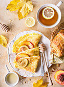 Pancakes with peaches in fall styling