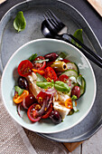 Summer salad with tomatoes, mozzarella, and olives