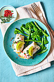 Plaice rolls with a lime and thyme filling and green vegetables