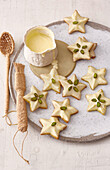 Pistachio stars with orange butter icing
