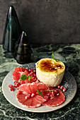 Quark mousse with grapefruit and pomegranate salsa