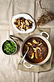 Braised ox cheeks with beans and mushrooms