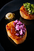 Fried scallops with purple cauliflower and broccoli