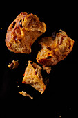 Pieces of gugelhupf on a black background