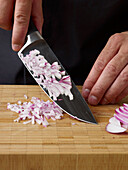 Chopping red onion