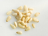 Pine nuts on a light background