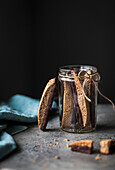A jar of chocolate dipped biscotti cookies