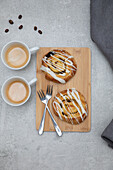 Raisin Pastry on a wooden chopping board with coffee