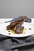 Lamb cutlets with hoisin and balsamic glaze, grilled shallots