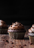 Homemade chocolate cupcake on a wooden table