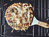 Okonomiyaki (Japanese pizza) with Katsuobushi (bonito flakes)