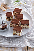 Tiramisu cuts with raspberries