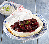 Beets in a parchment parcel with horseradish dip