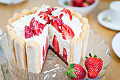 Strawberry-Mascarpone-Charlotte, with a piece cut out